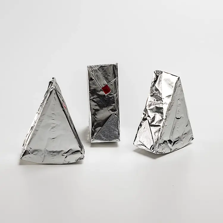 Processed cheese portions wrapped in aluminium foil with the red opening band